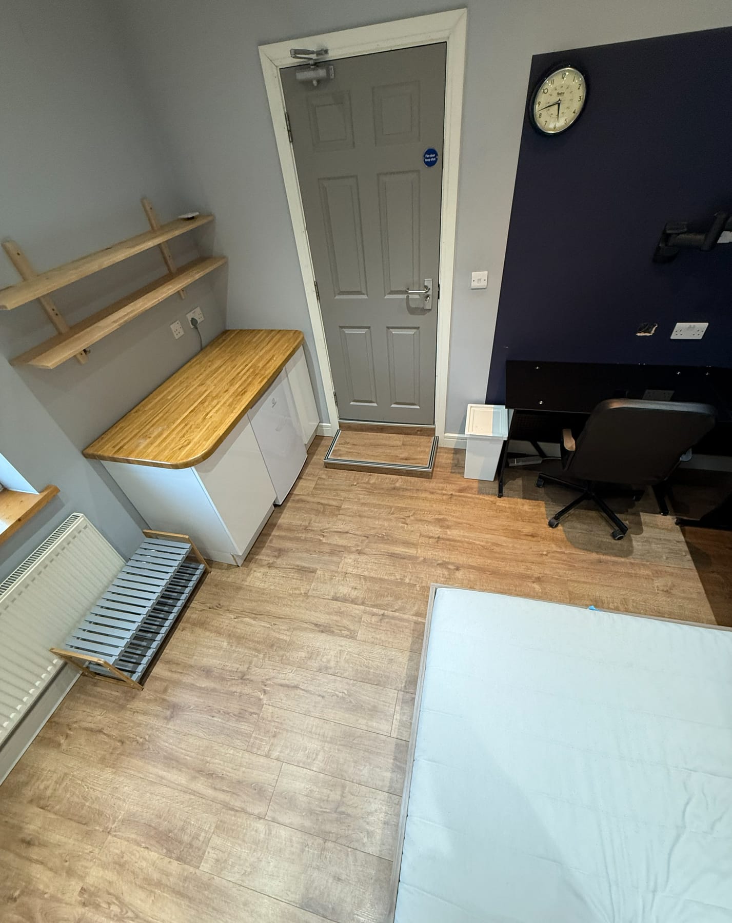 Room set up with a desk, current condition